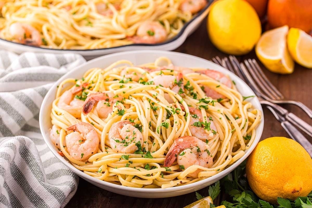 A tangy and delightful bowl of pasta with zesty shrimp and vibrant lemons, perfect for quick and easy recipes.