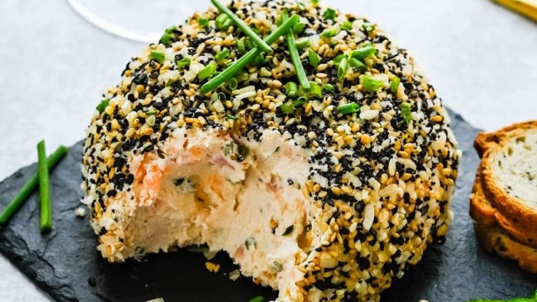 A delicious salmon cheese ball recipe topped with sesame seeds.