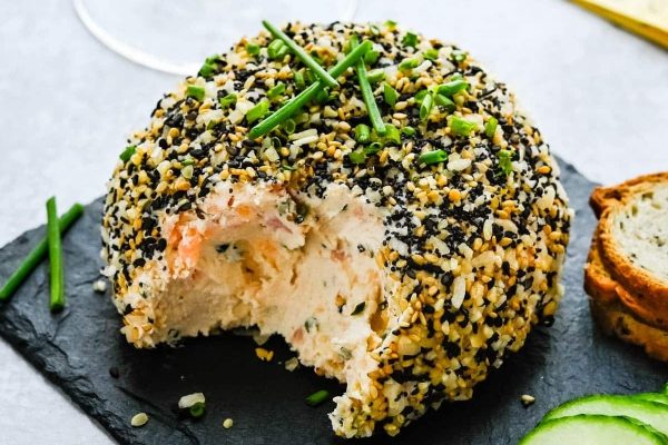 Cheese ball recipe featuring salmon, sesame seeds, and cucumbers.