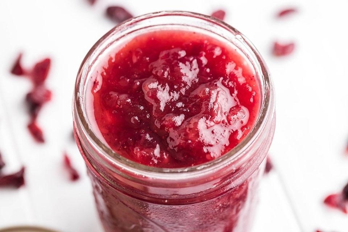 Delicious cranberry sauce in a mason jar, perfect for holiday recipes. This is one of the best cranberry sauce recipes.