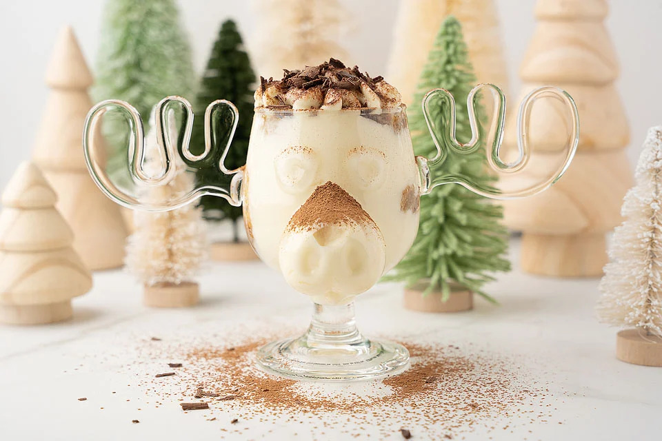 A glass of milk with a moose on top, perfect for Christmas trifles. This is one of the best Christmas trifle recipes.