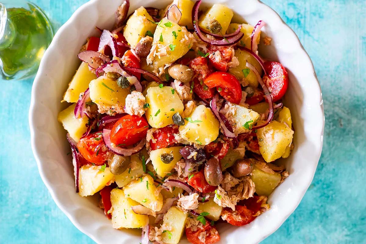 Italian potato salad with tomatoes and olives.