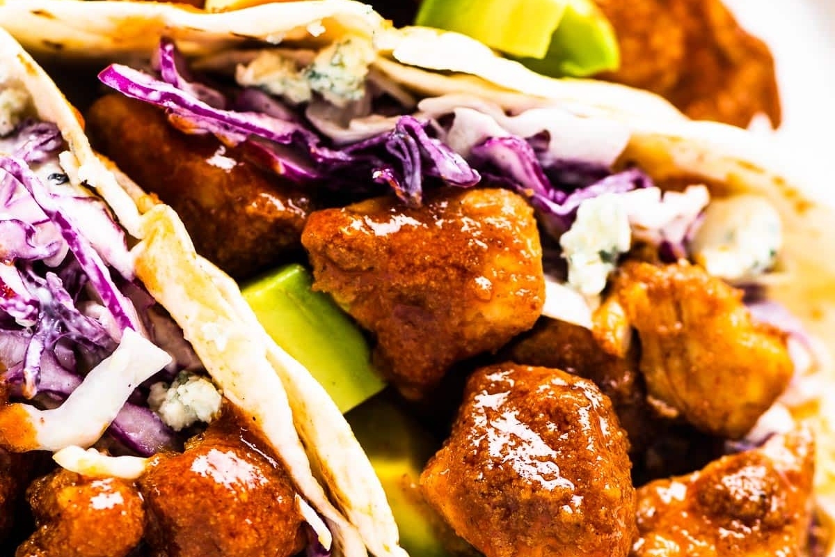 A plate of chicken tacos with cabbage and slaw, perfect for Taco Night or quick dinners.