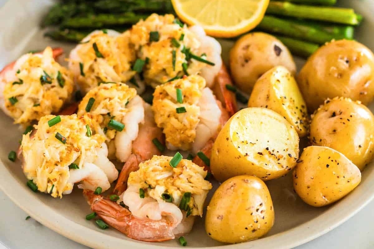 Celebrate New Year's Eve with an elegant and simple dish featuring shrimp, potatoes, and asparagus plated beautifully.