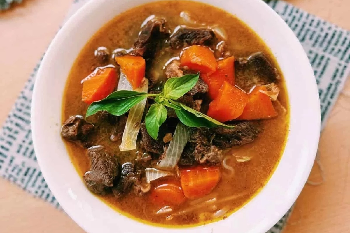 Recipe: A delicious beef stew infused with the flavors of carrots and herbs.