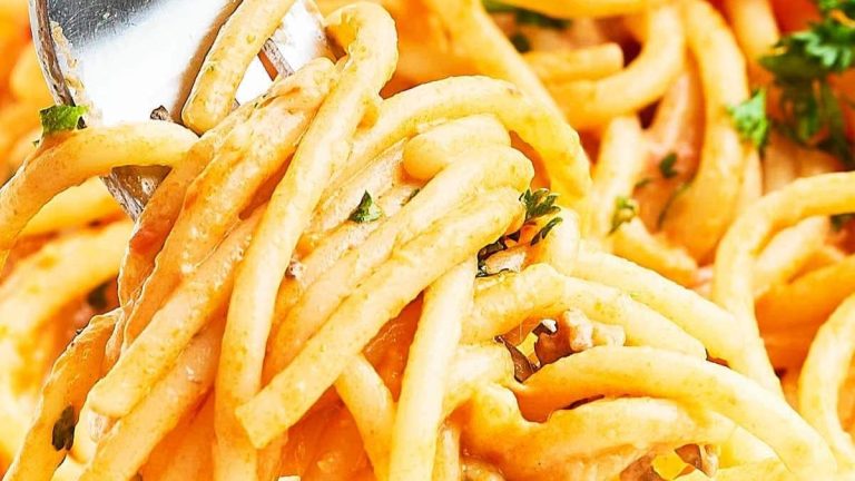 A fork is being used to eat delicious spaghetti, the ultimate comfort food.