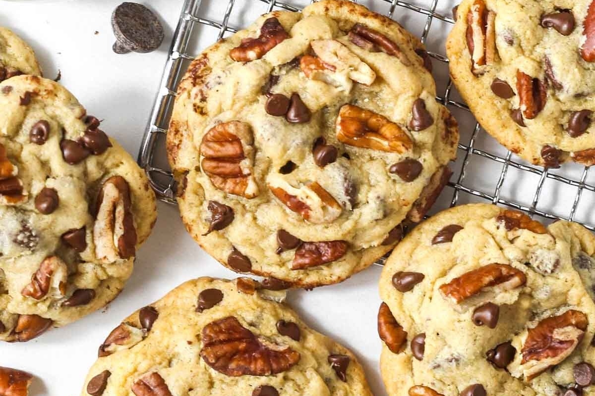 Freezable pecan chocolate chip cookies on a cooling rack.