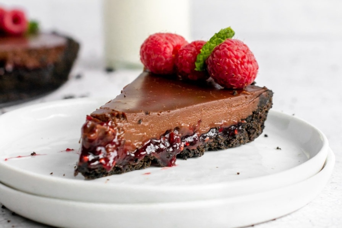 A delectable slice of chocolate raspberry pie on a plate.