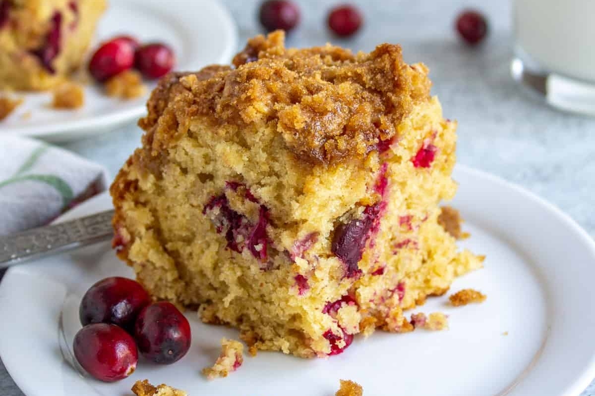 A sweet slice of cranberry coffee cake on a plate for breakfast.
