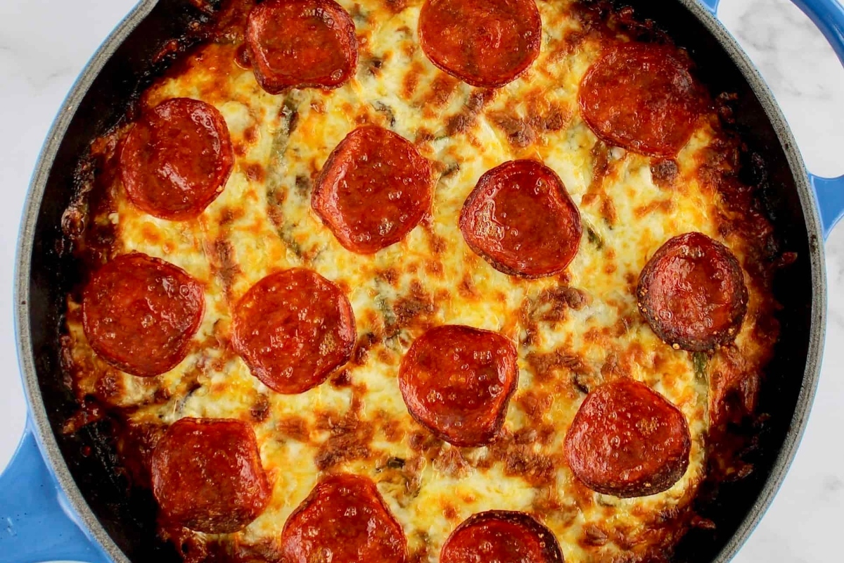 Low Carb pepperoni pizza in a blue skillet.