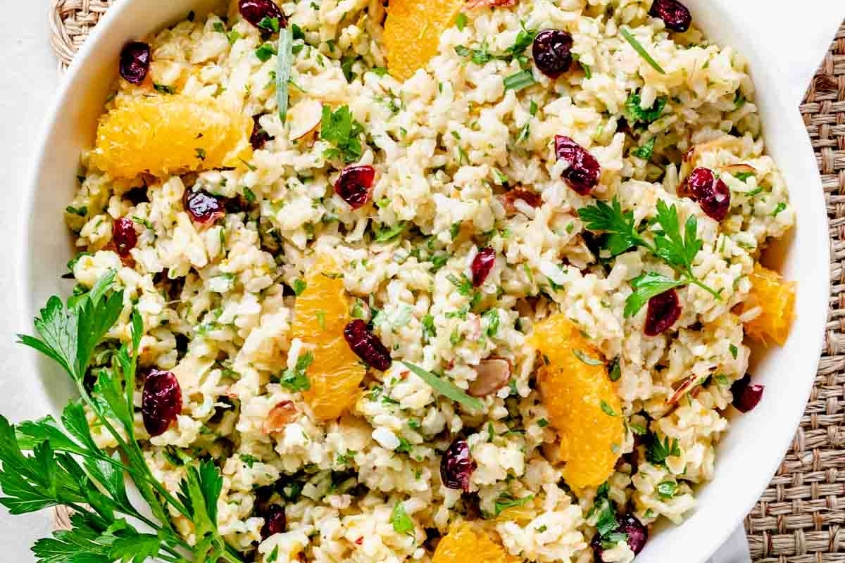 Christmas-themed cranberry orange rice salad in a white bowl.