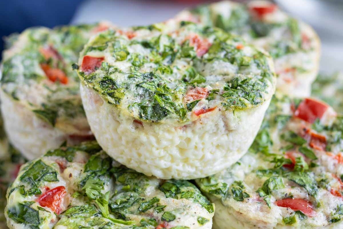 A stack of healthy spinach and tomato muffins, perfect for high protein breakfasts.