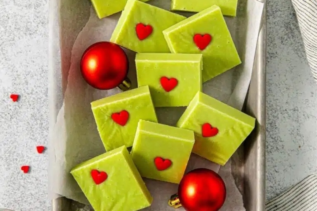 A tray of green chocolate bars with red hearts on it, perfect for Christmas.