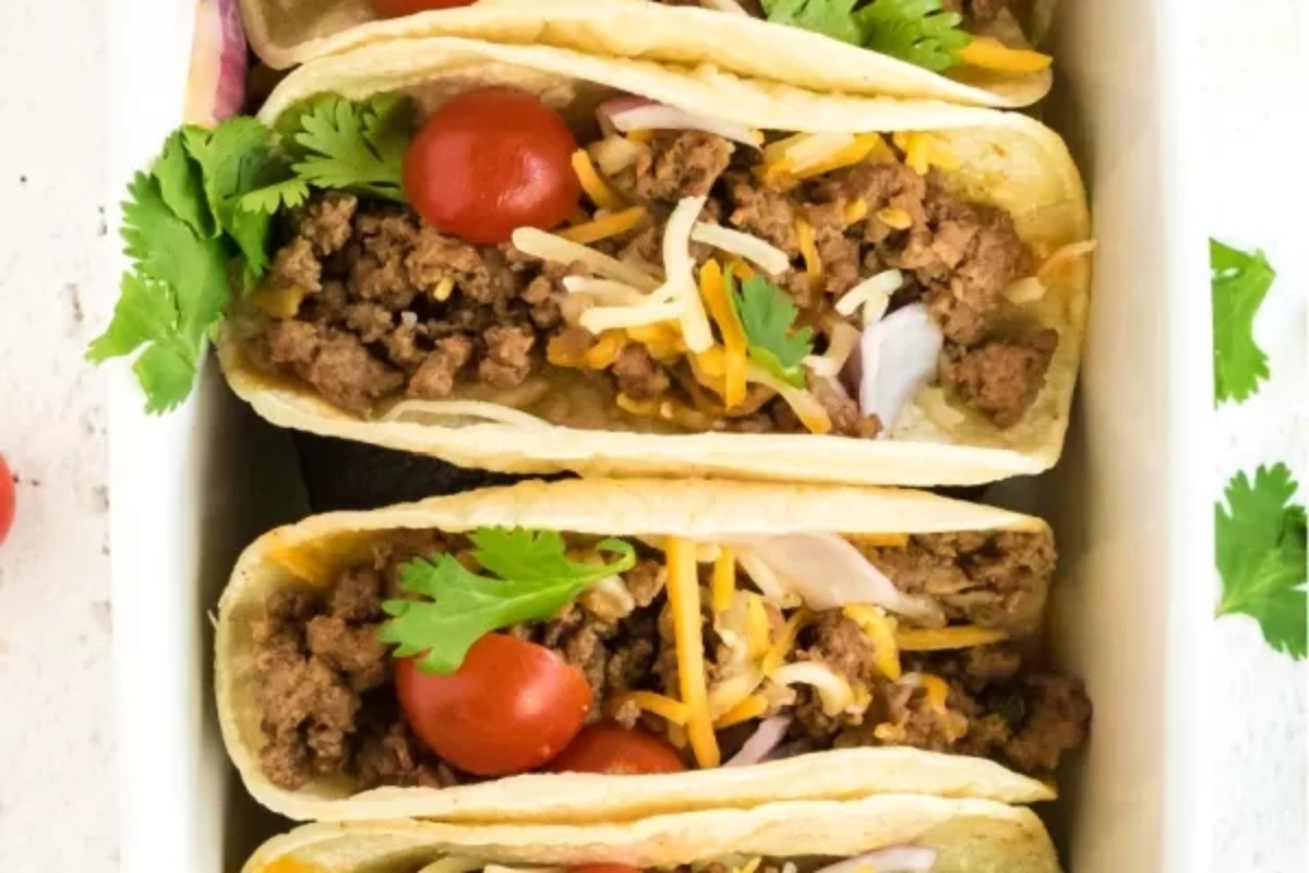 Taco Night: Four beef tacos in a white dish.