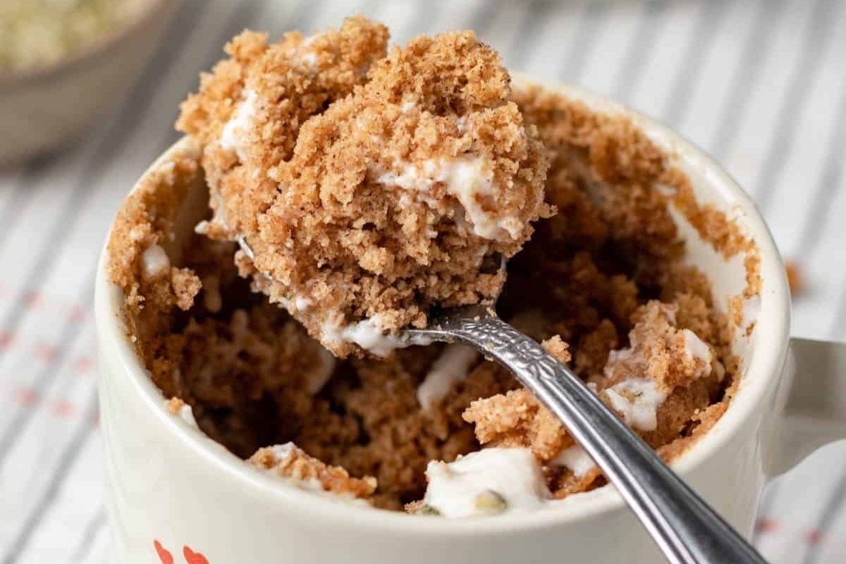 A delicious mug cake recipe featuring a spoonful of cookie dough.