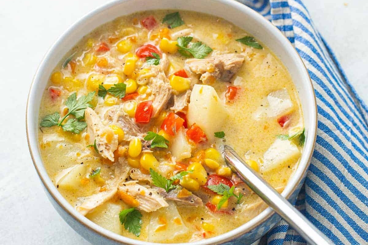 Chicken corn chowder in a bowl with a spoon. This soup is a delicious recipe for chowder lovers.