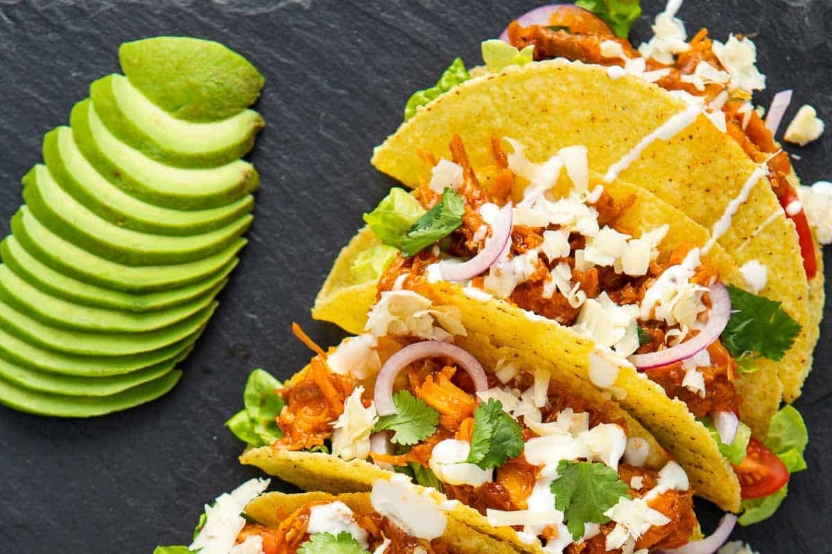 Join us for a delicious taco night dinner featuring flavorful chicken and creamy avocado.