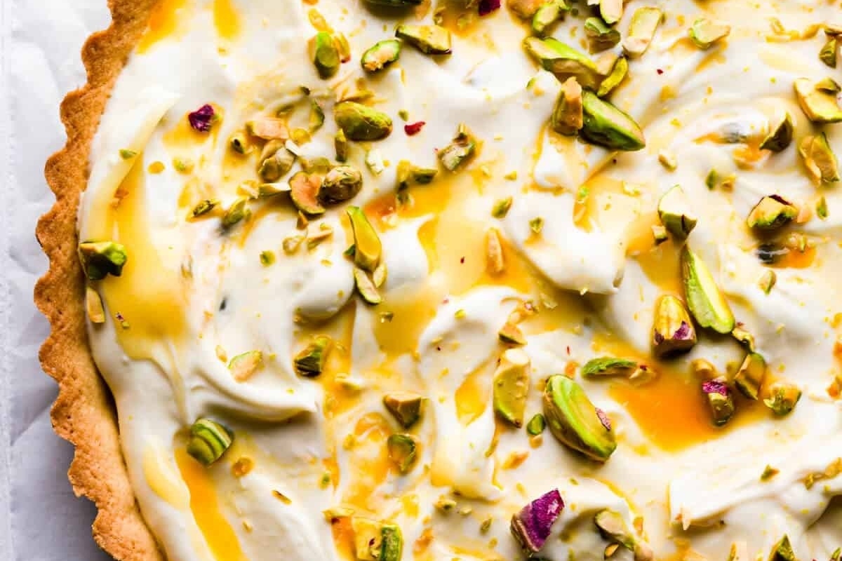 A delicious tart topped with creamy pistachios.