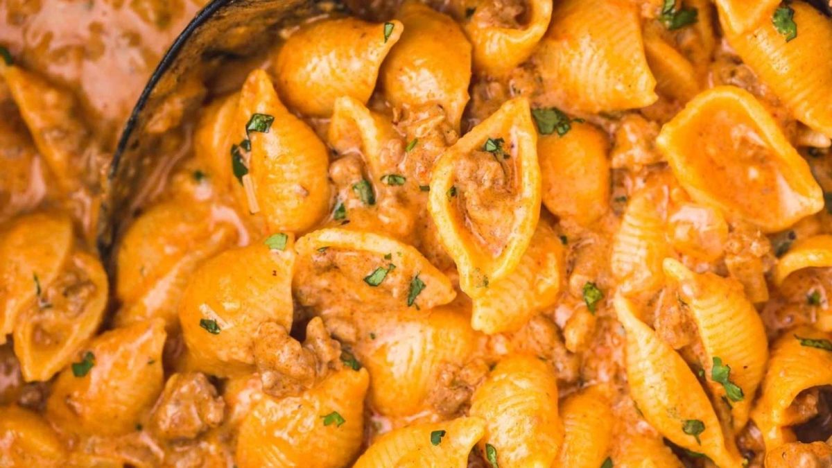 A close up of pasta in a sauce.