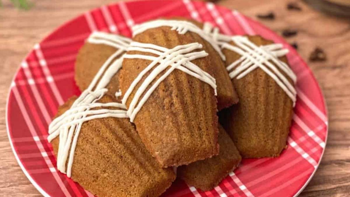 Best Cookie Recipes for Mother's Day 34 A plate of cinnamon rolls with icing, perfect for those craving a delicious treat.