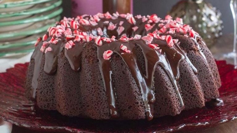 A chocolate bundt cake with a hint of Candy Cane flavor on a red plate.