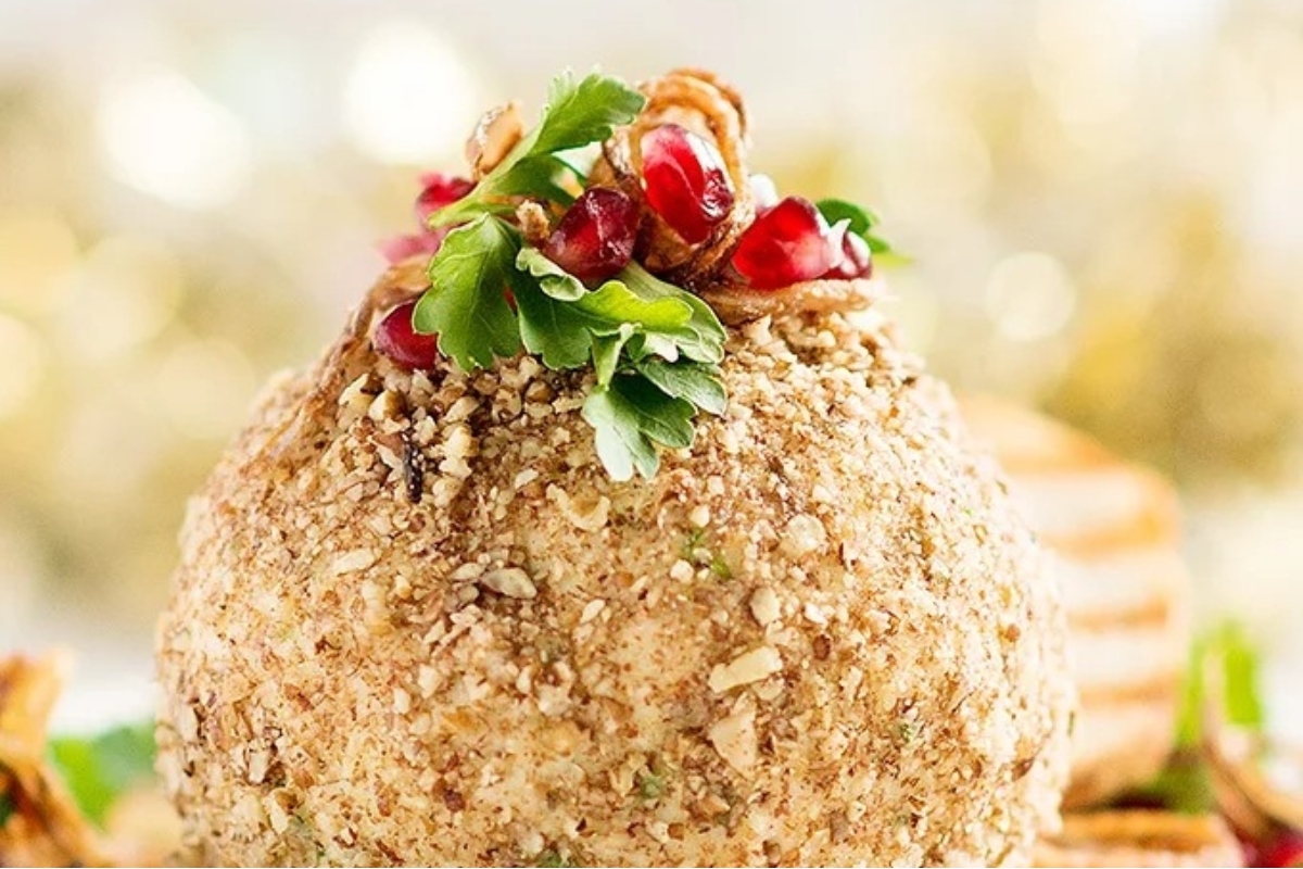 A festive cheese ball topped with pomegranate.