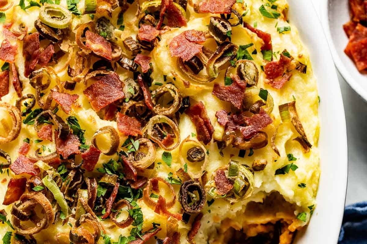 A delightful Christmas dish of potato casserole with bacon and onions, perfect for serving as a side dish.
