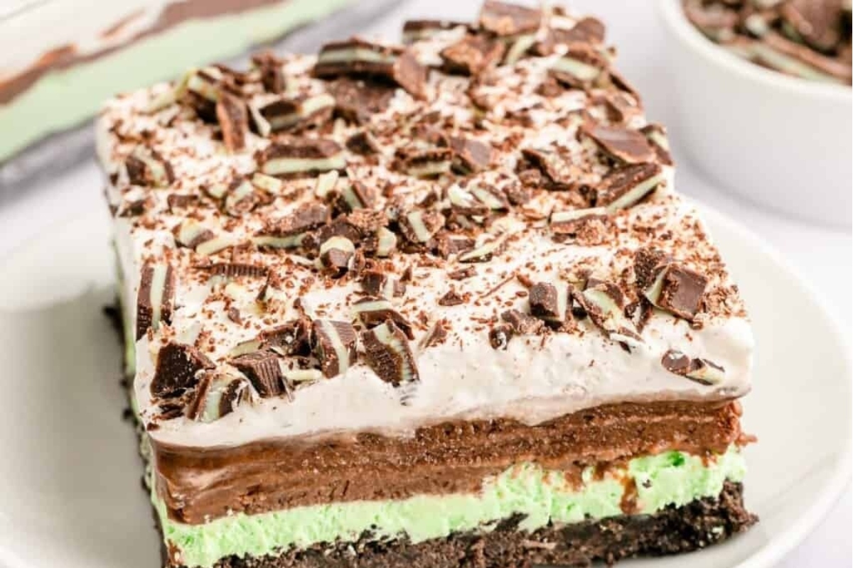 A mouthwatering dessert, a slice of mint ice cream cake, delicately placed on a plate.