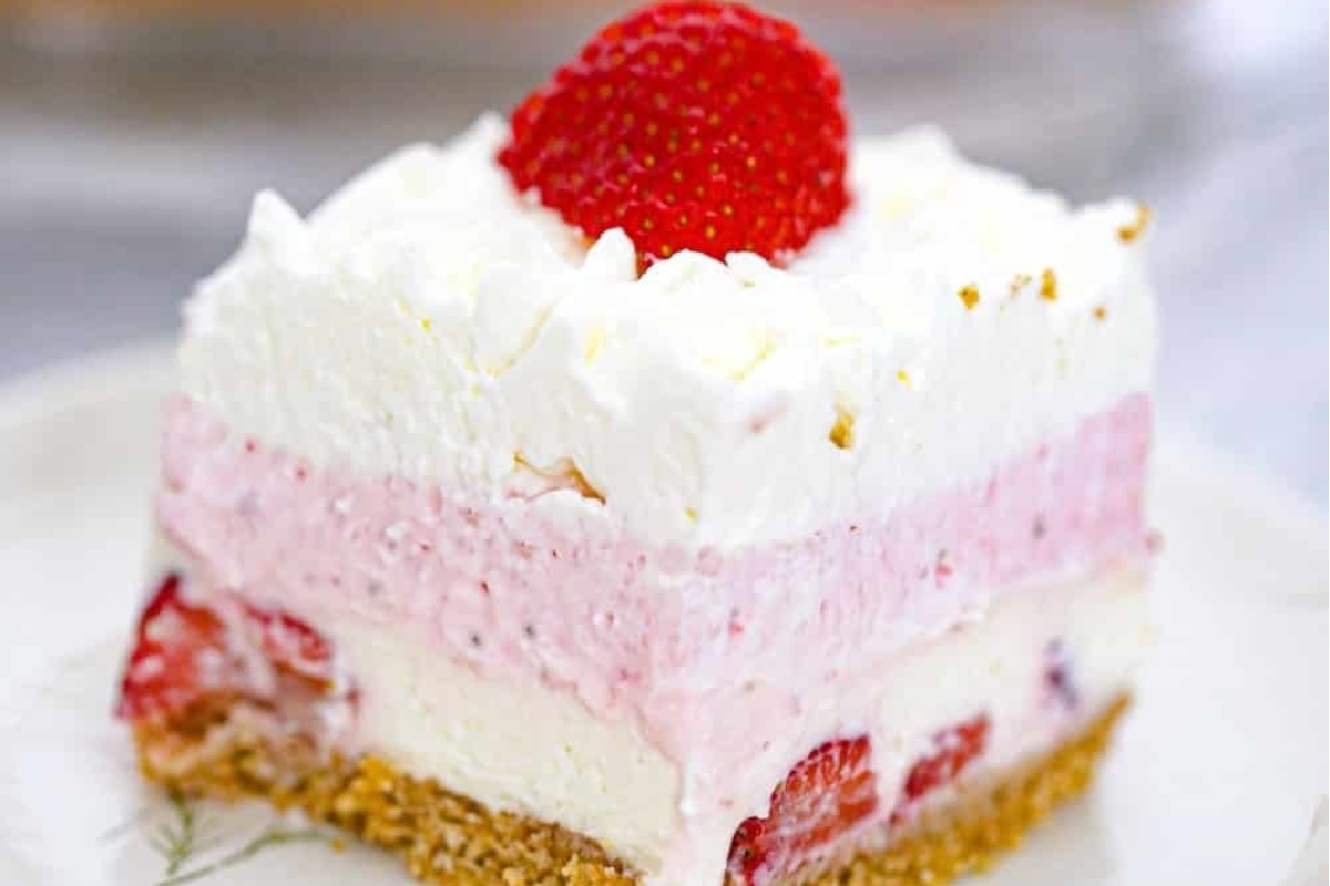 A slice of strawberry ice cream cake, a delicious dessert, on a plate.