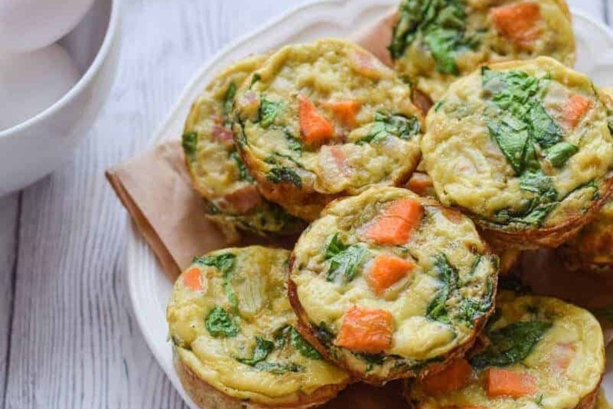 Spinach muffins on a white plate.