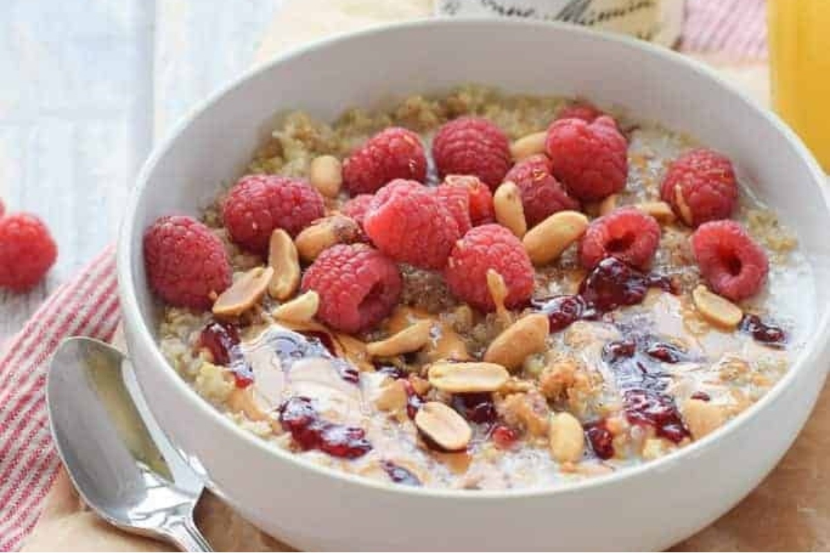 An easy and delicious breakfast recipe consisting of a bowl of oatmeal topped with raspberries and almonds.
