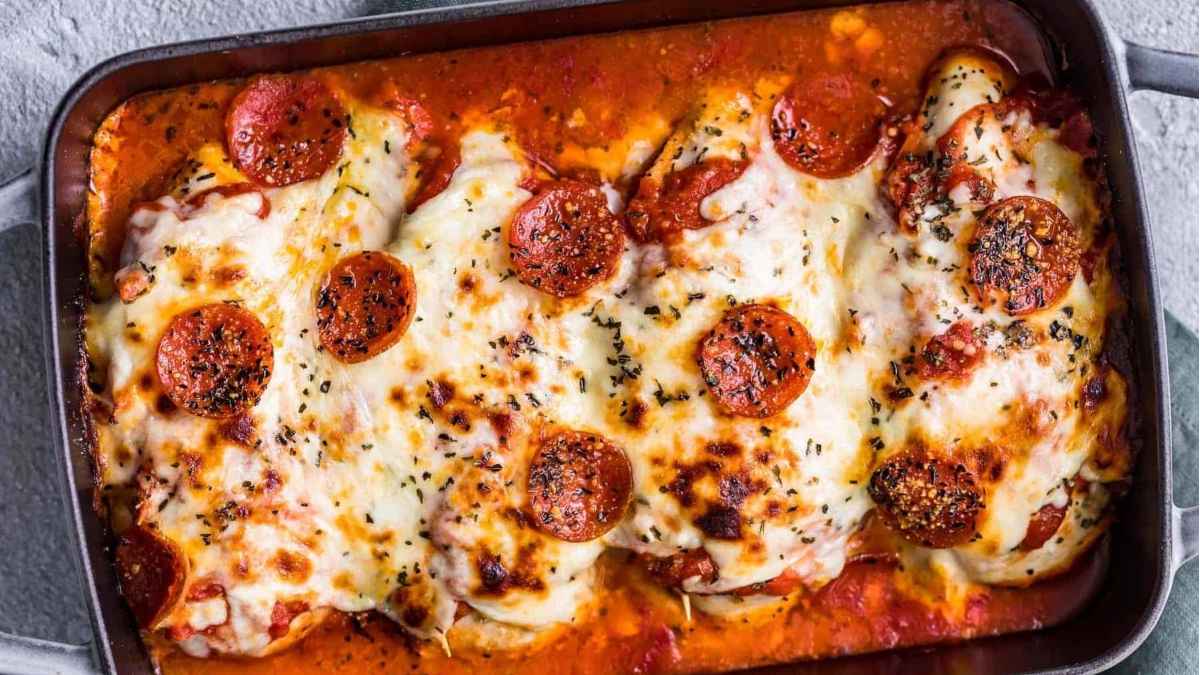 Pizza chicken breast on a tray.