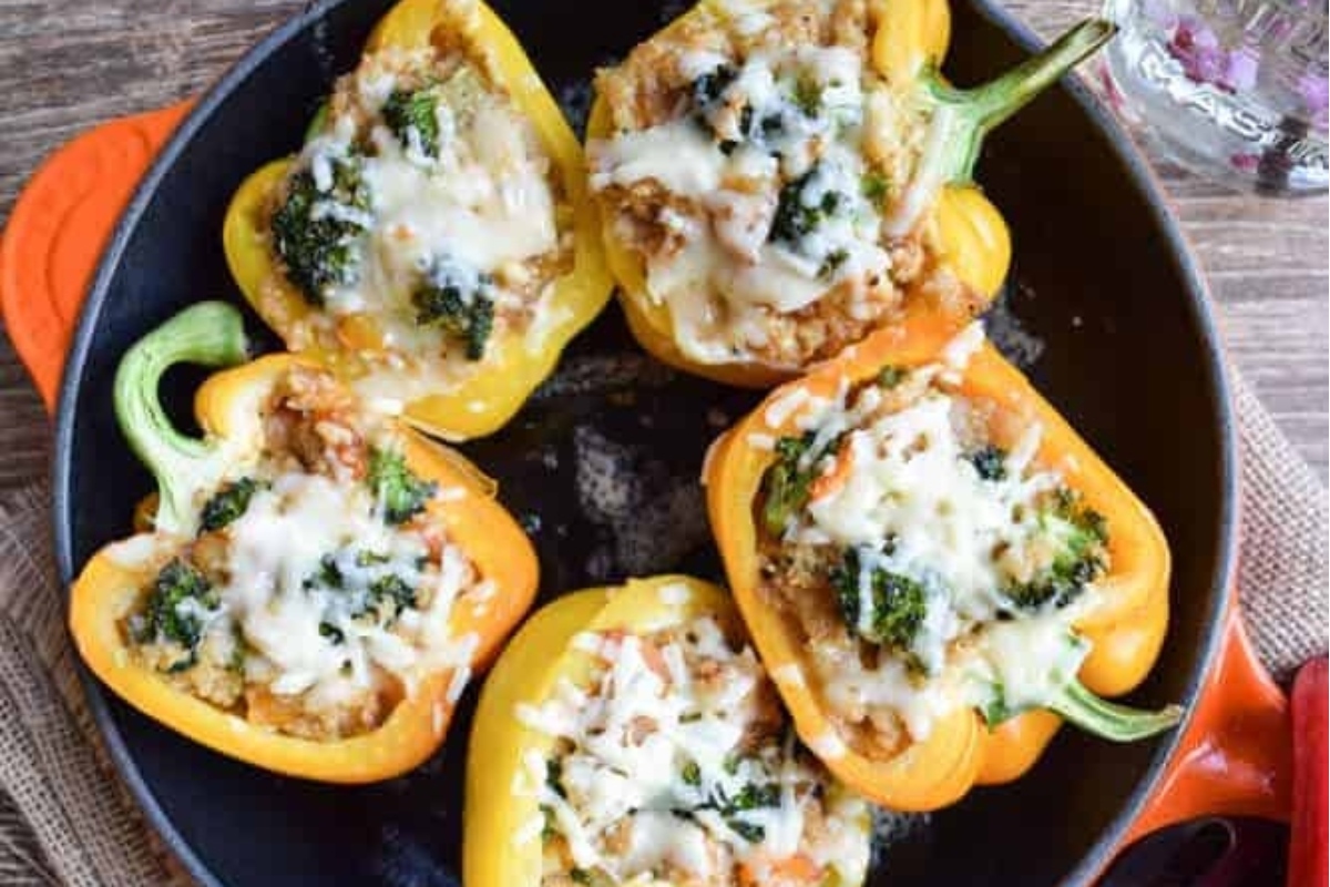 Delicious skillet recipe with stuffed peppers, featuring the healthy addition of broccoli and melted cheese.