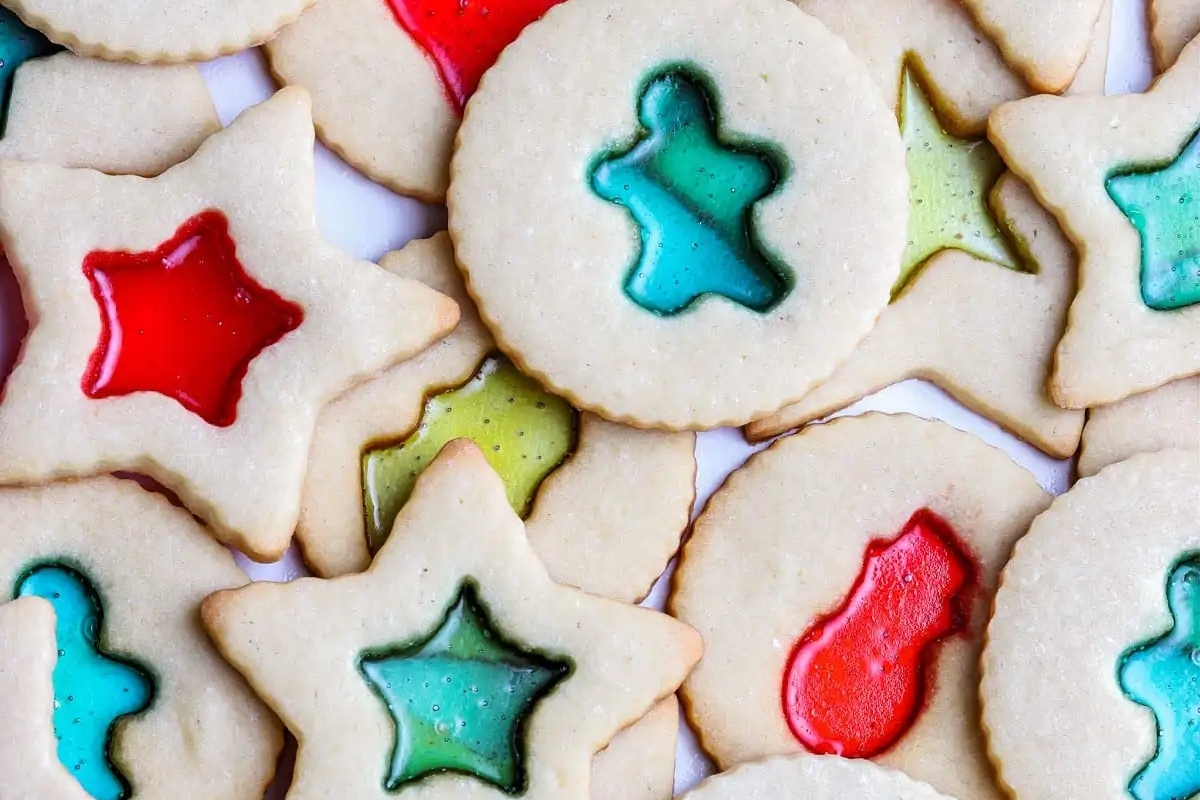 A group of Cut Out Sugar Cookies decorated with colorful icings in festive Christmas designs.