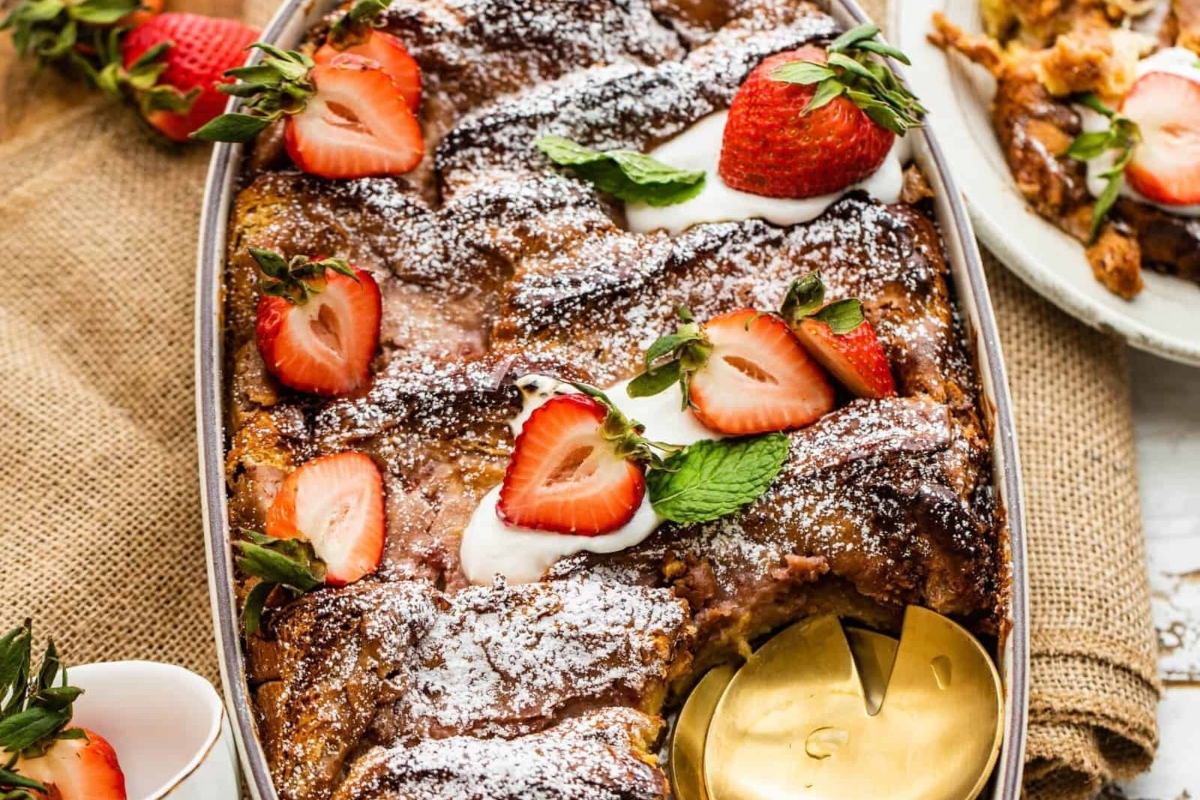 French toast casserole with strawberries and powdered sugar is a delicious breakfast option that can be baked for Christmas morning.