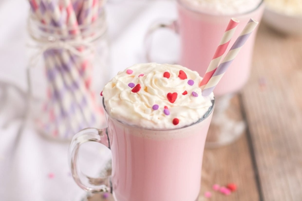 Valentine's day hot chocolate milkshake with whipped cream and sprinkles.
