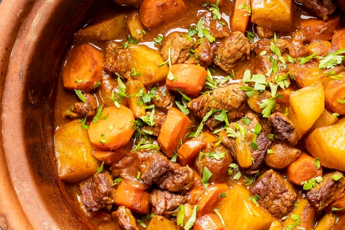 Stew cooked in a slow cooker with meat and vegetables.