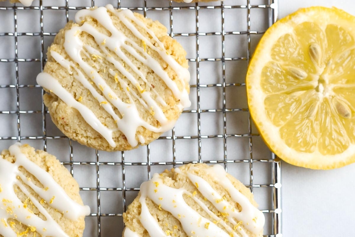 Freezable lemon cookies with icing on a cooling rack.