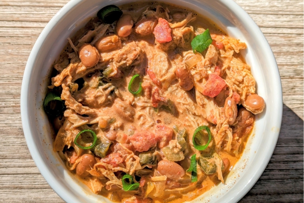 A slow cooker filled with a delicious white bean and chicken chili.