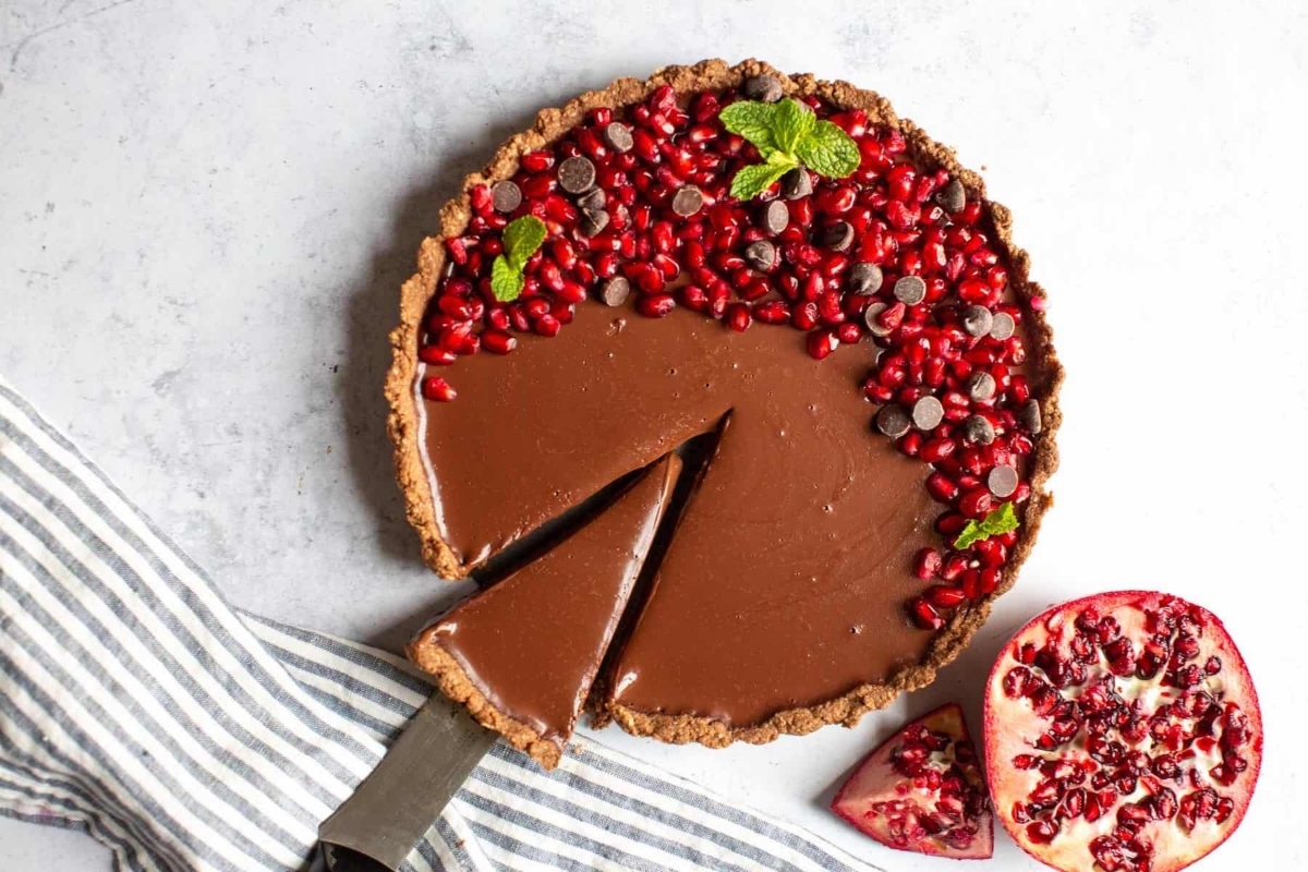 Valentines' Day Chocolate pomegranate tart with pomegranate seeds.