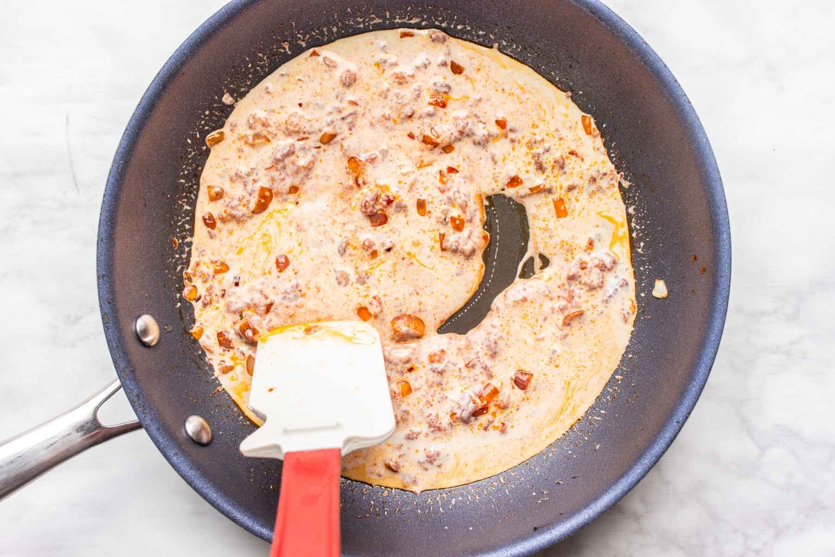 A frying pan with a spatula.