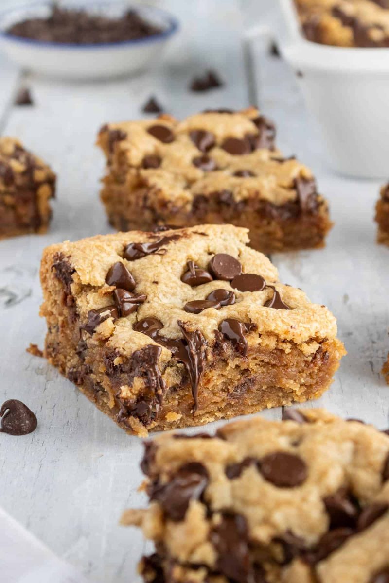 Peanut butter chocolate chip bars on a white table.