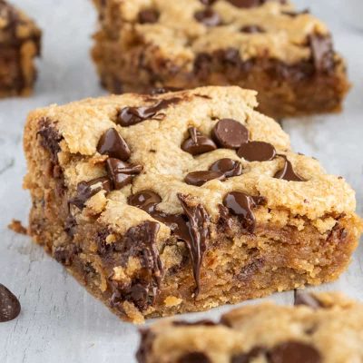 Peanut butter chocolate chip bars on a white background.