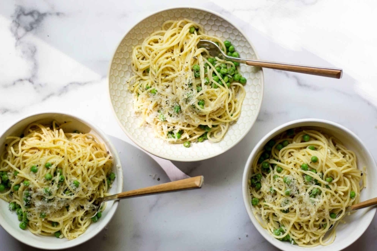 A family favorite, these inexpensive dinners feature three bowls of pasta packed with love, accompanied by peas and parmesan.