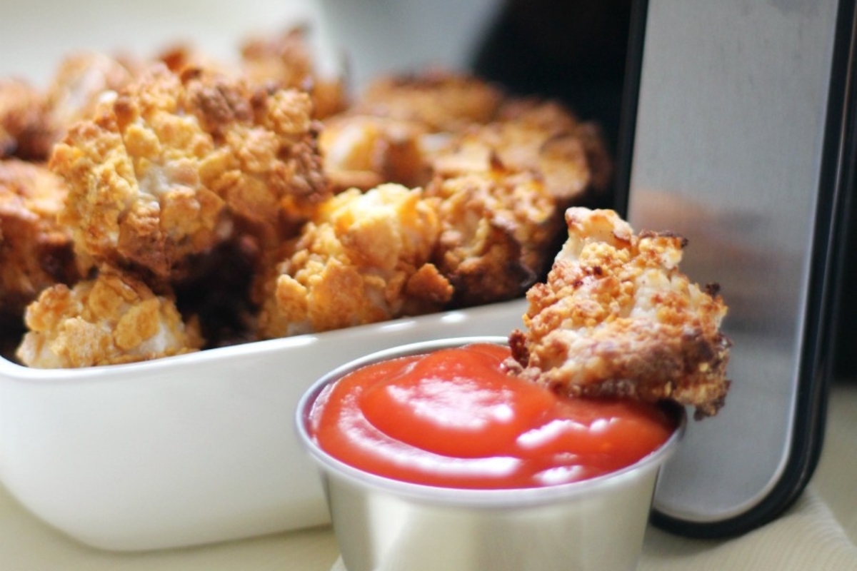 31 Guilt-Free Air Fryer Recipes for Every Meal 30 Fried chicken nuggets in a bowl with ketchup.