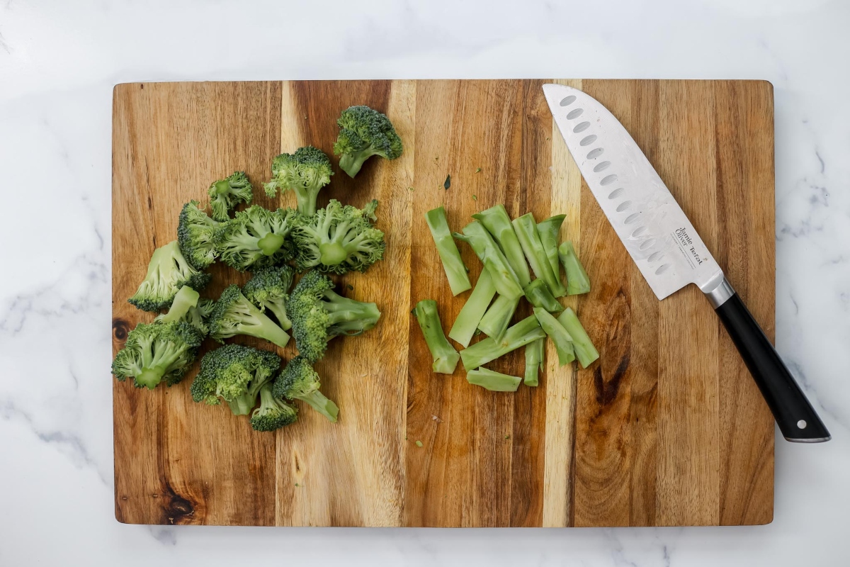 Chopped broccoli on a cutting board.