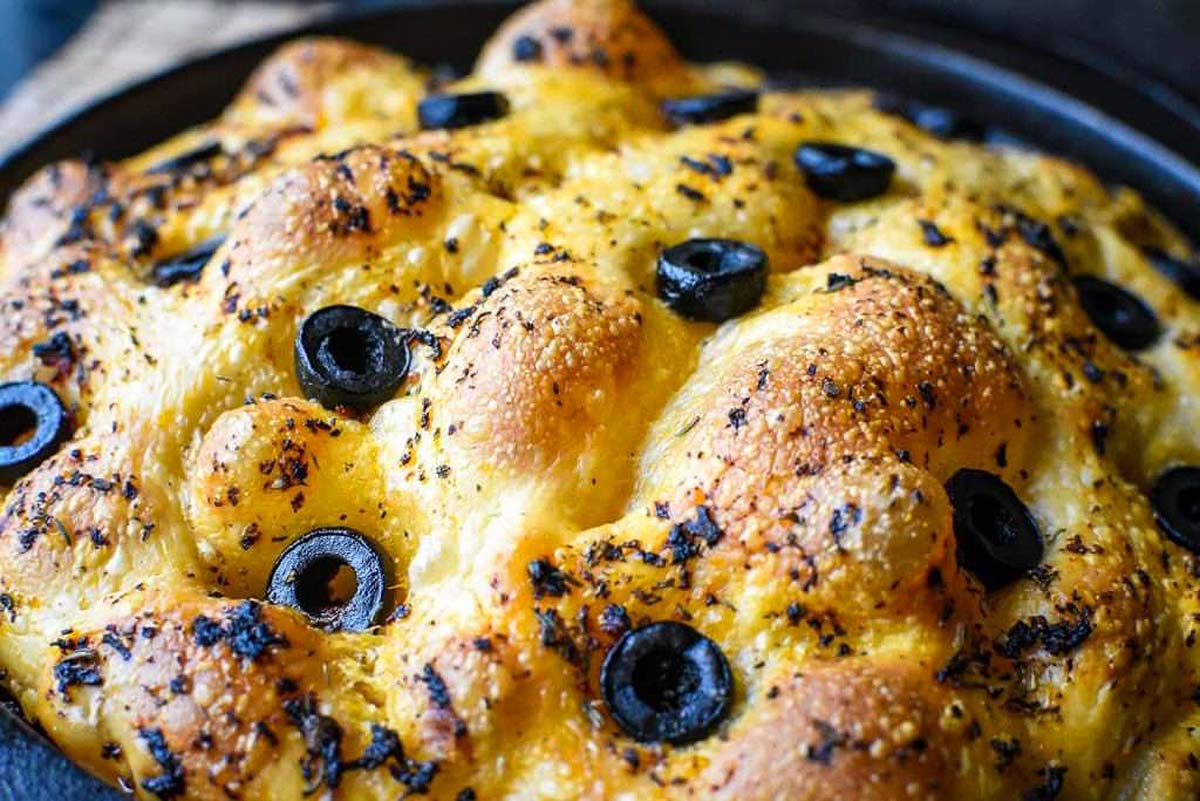 Overnight Sourdough Focaccia With Herbs and Olives.