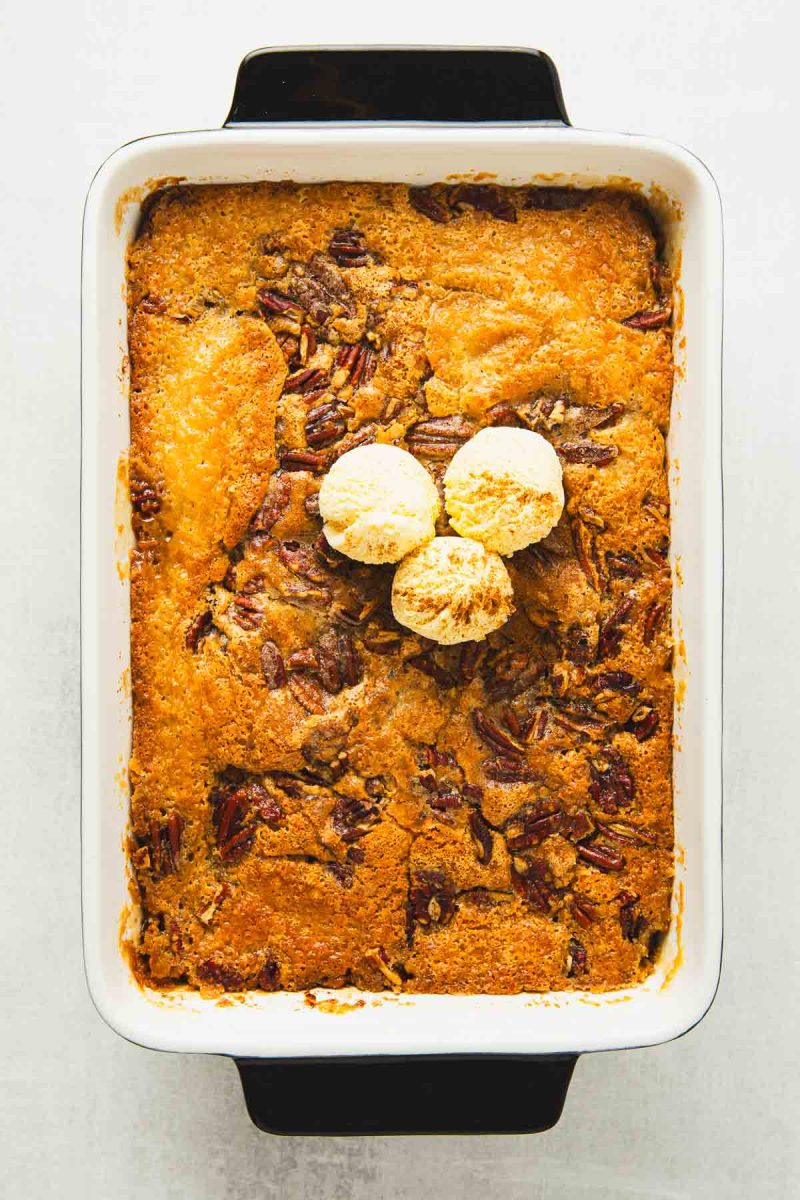 A baking dish with a pecan cobbler in it.