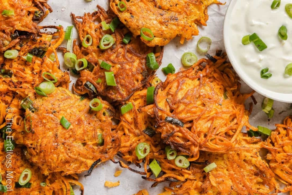 Creative Sweet Potato Recipes 13 Sweet potato pancakes with sour cream and green onions.