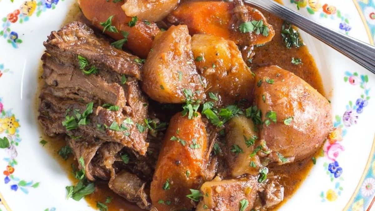 A plate full of slow cooked pot roast.
